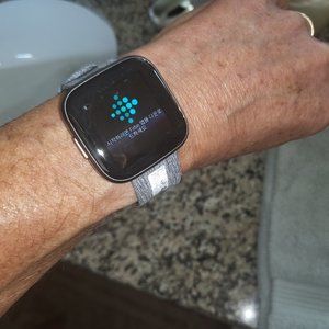 Fitbit Versa 2 smartwatch with custom cloth band and charger